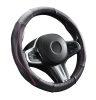 Couvre volant en cuir noir matelassé avec motif ligne fushia Ø38cm
